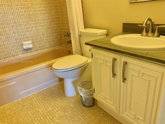 full bathroom featuring toilet, vanity, tile floors, and bathing tub / shower combination