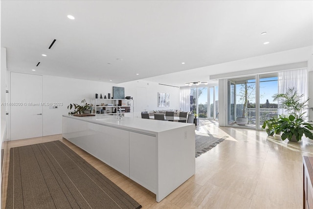 kitchen featuring sink and white cabinets