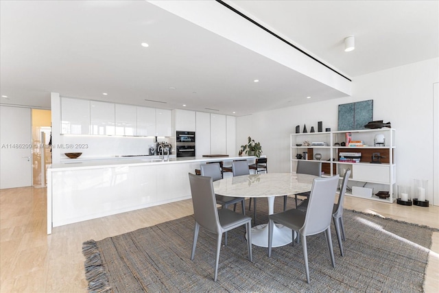 dining area with light wood-type flooring