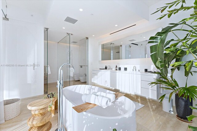 full bathroom featuring independent shower and bath, tile patterned floors, toilet, and vanity