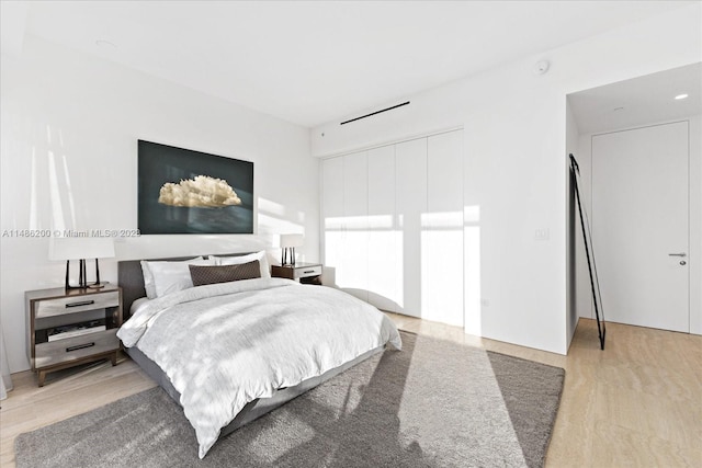 bedroom featuring light hardwood / wood-style floors