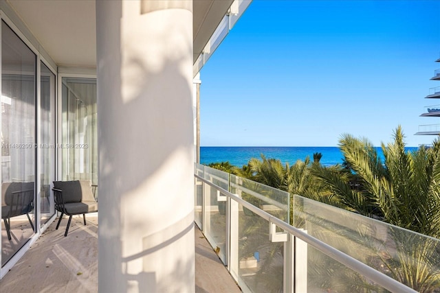 balcony featuring a water view