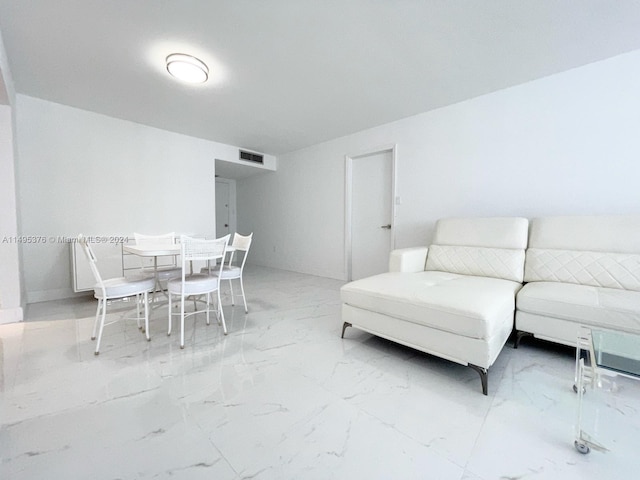 living room with tile patterned floors