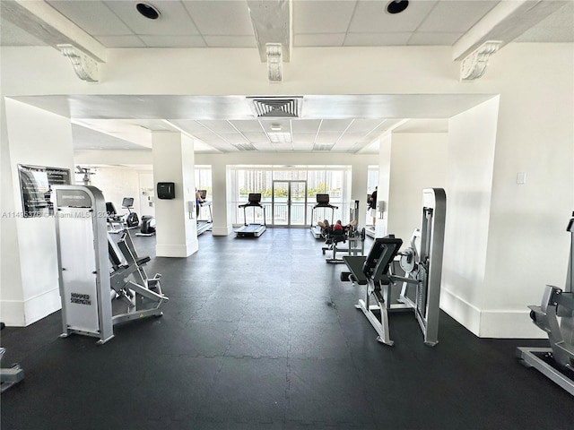 workout area with a paneled ceiling