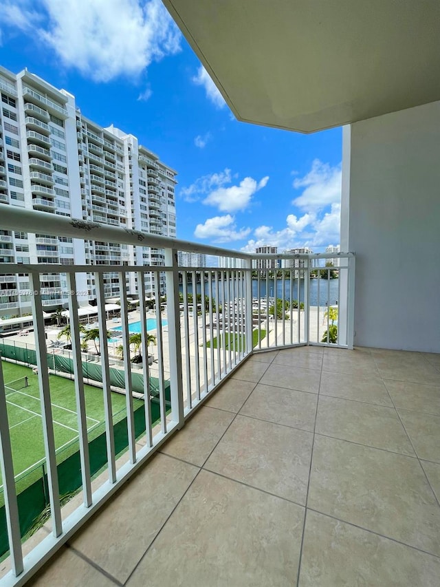 balcony featuring a water view