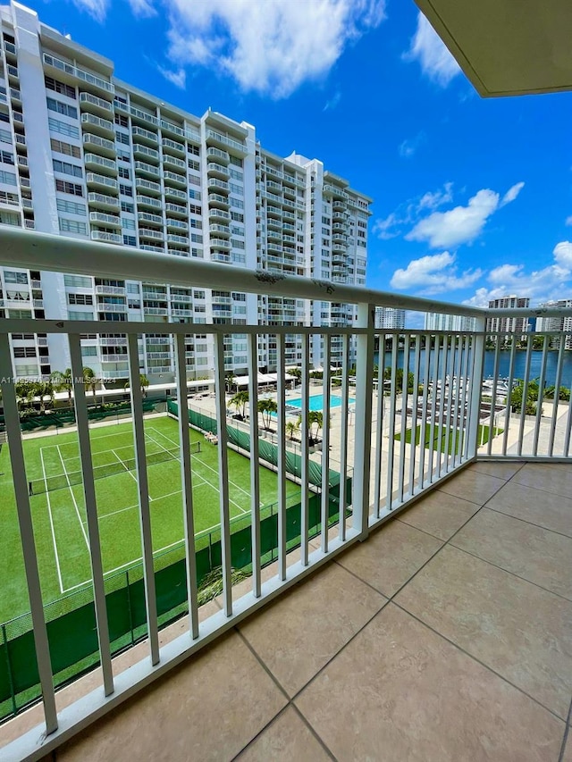 balcony featuring a community pool