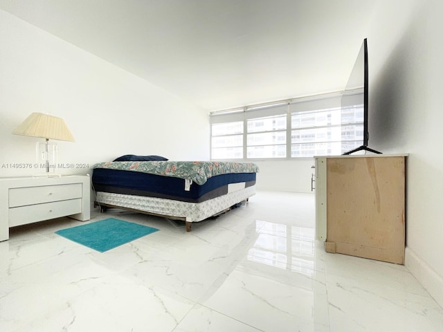 bedroom with light tile patterned floors