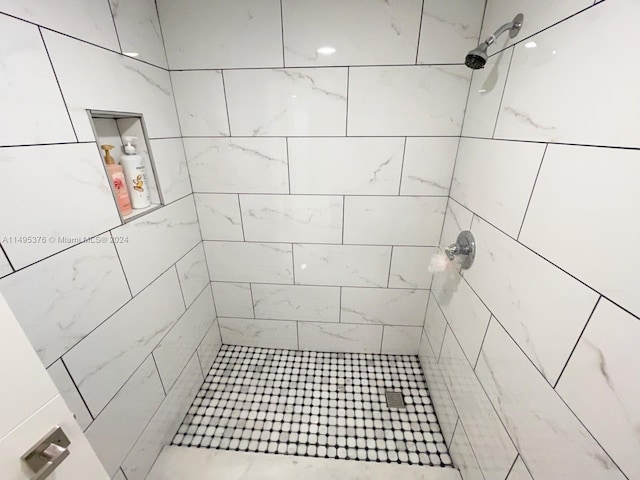 bathroom with tiled shower