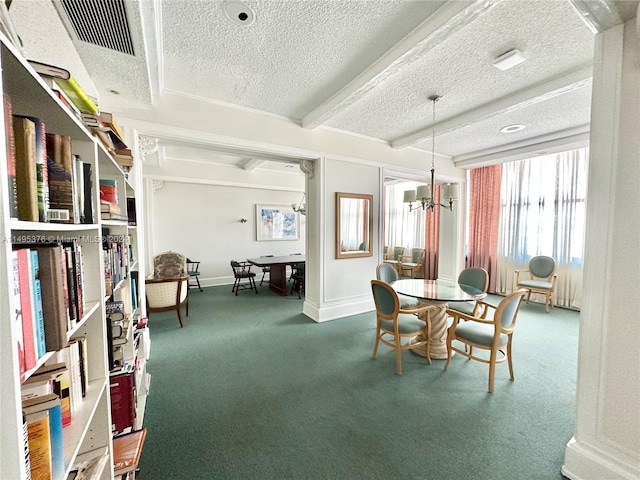 dining space featuring carpet flooring, a textured ceiling, and a chandelier