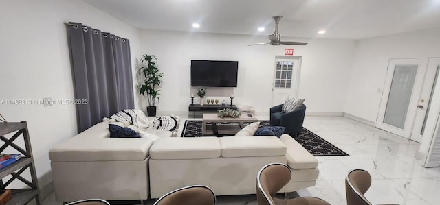 tiled living room featuring ceiling fan