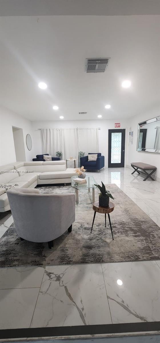 living room featuring light tile floors