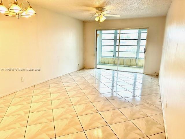 9620 Sunrise Lakes Blvd Unit 306, Sunrise, FL 33322 - unfurnished room with a chandelier, ceiling fan, and a textured ceiling