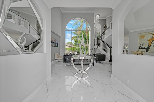 entrance foyer featuring crown molding