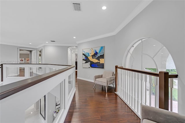 hallway featuring dark wood-type flooring and ornamental molding