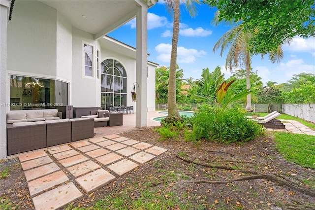 view of yard with an outdoor living space and a patio