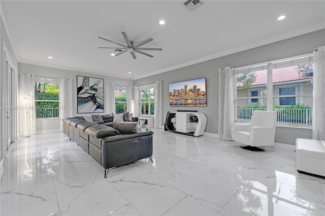 living room with ceiling fan and crown molding