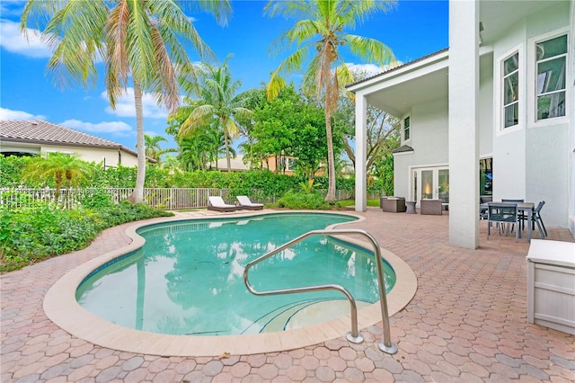 view of pool featuring a patio area