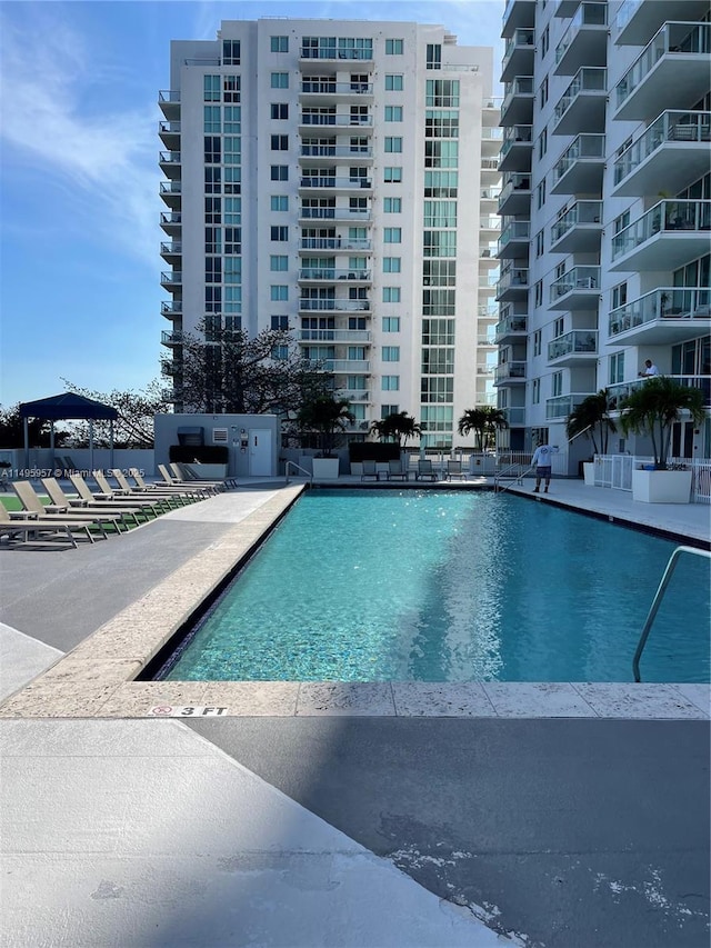 view of swimming pool featuring a patio area