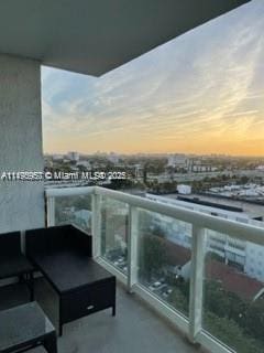 view of balcony at dusk