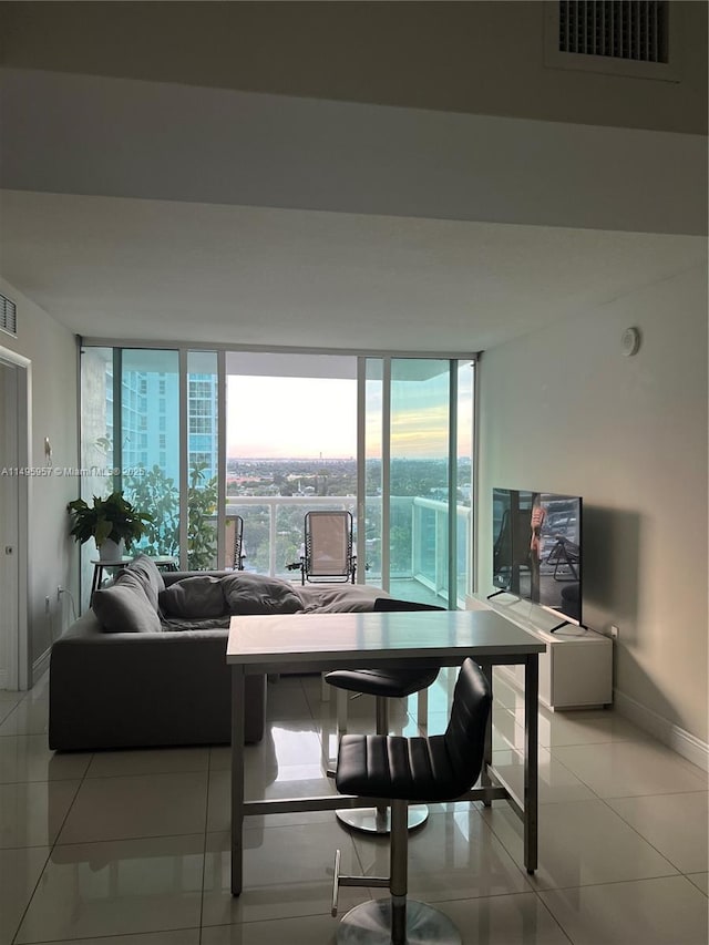 dining area with plenty of natural light and light tile patterned flooring