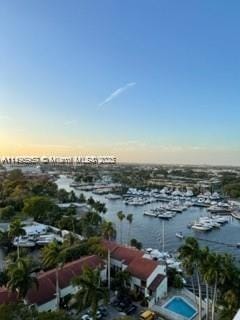 aerial view at dusk with a water view