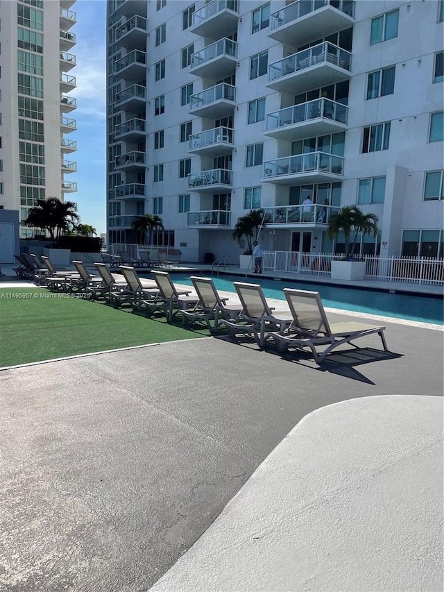 view of swimming pool featuring a patio area