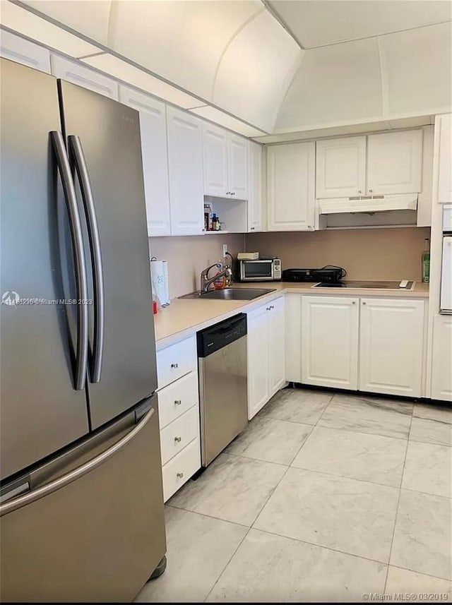 kitchen with white cabinets, light tile floors, appliances with stainless steel finishes, and sink