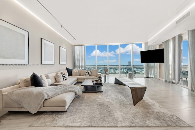 tiled living room with a wall of windows