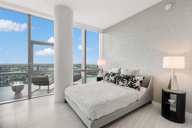 bedroom featuring a wall of windows