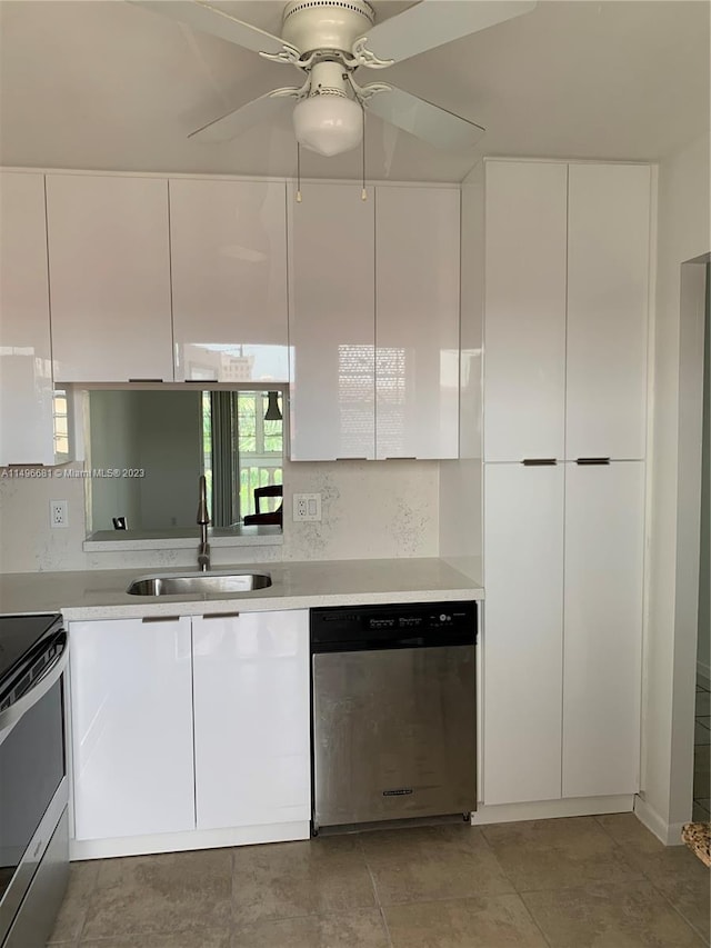 kitchen featuring white cabinetry, stainless steel appliances, sink, and ceiling fan