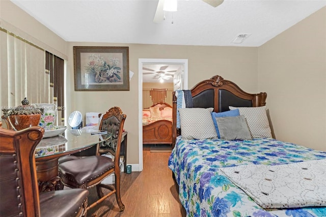 bedroom with light hardwood / wood-style flooring and ceiling fan