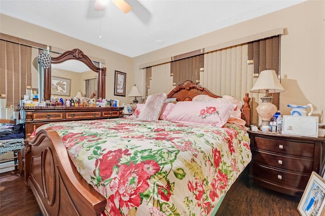 bedroom featuring dark wood-type flooring and ceiling fan