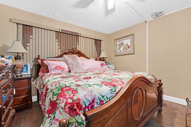 bedroom featuring dark wood-type flooring and ceiling fan