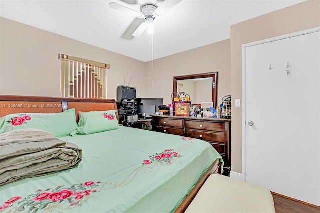 bedroom featuring ceiling fan and hardwood / wood-style floors