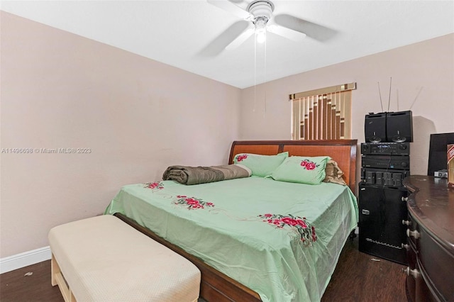 bedroom with dark hardwood / wood-style floors and ceiling fan