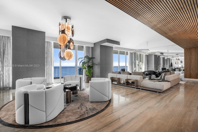 living room featuring a water view and hardwood / wood-style floors