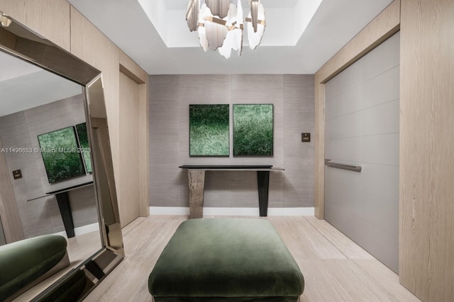 bathroom featuring a notable chandelier and hardwood / wood-style floors