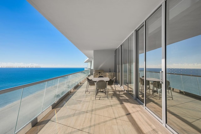 balcony featuring a water view