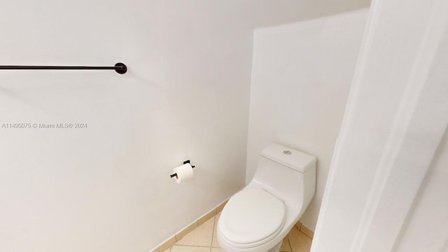 bathroom featuring tile patterned flooring and toilet