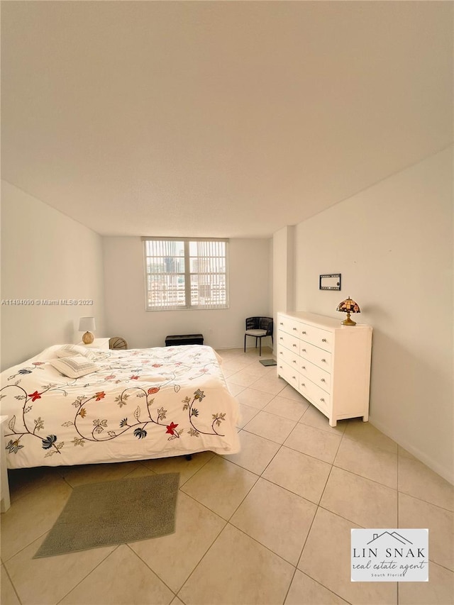 unfurnished bedroom featuring light tile patterned flooring