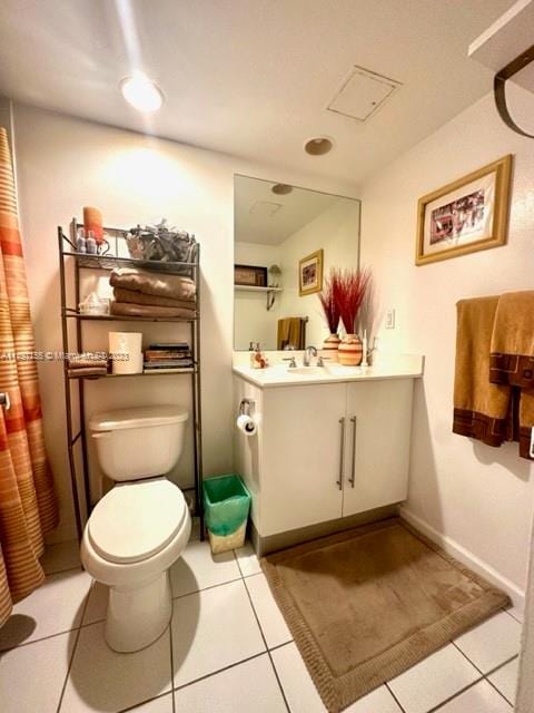 bathroom featuring vanity, toilet, and tile patterned floors