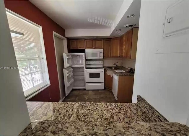 kitchen featuring sink and white appliances