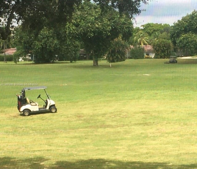 view of property's community with a lawn