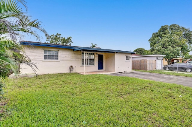 ranch-style house with a front yard