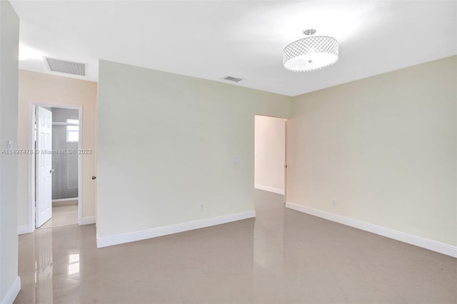 unfurnished room featuring light tile floors