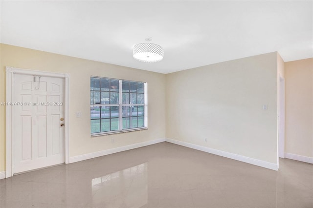 unfurnished room featuring light tile floors