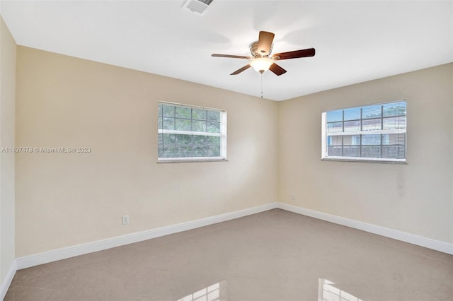 carpeted empty room featuring ceiling fan