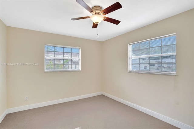 carpeted empty room with ceiling fan