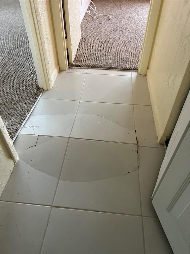 hallway featuring light tile patterned floors