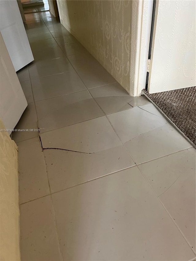 hallway with light tile patterned floors